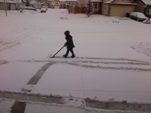Kid shovelling